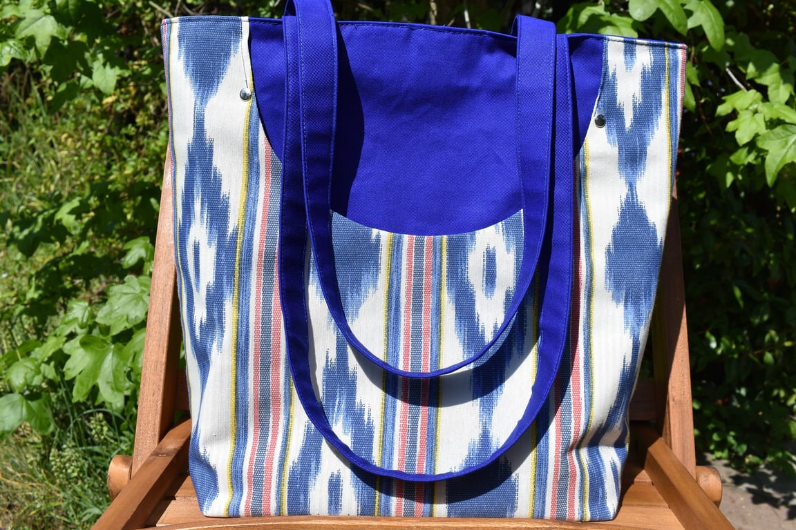 Blue cotton drill bag. Fits the shoulder. Pockets both inside and out. 