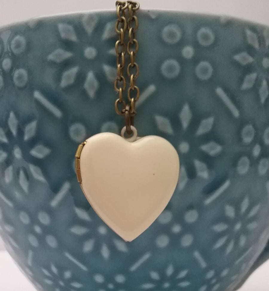 Ivory Enamel Heart Locket....