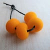 orange tumbled lampwork glass beads