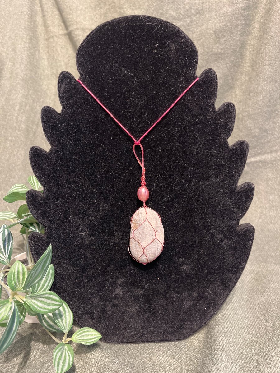 Beautiful wire wrapped grey pebble pendant on adjustable pink cord.  