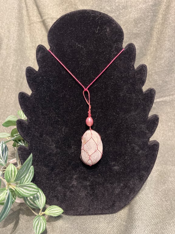 Beautiful wire wrapped grey pebble pendant on adjustable pink cord.  