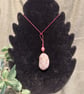 Beautiful wire wrapped grey pebble pendant on adjustable pink cord.  