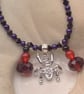 Sparkly Spider Pendant on a Purple and Black Necklace with Red & Black Charms