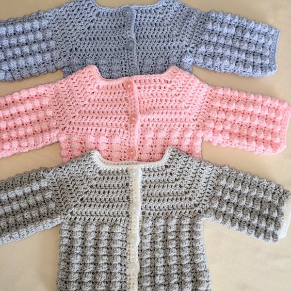 Newborn cardigans or jackets in three different colours 