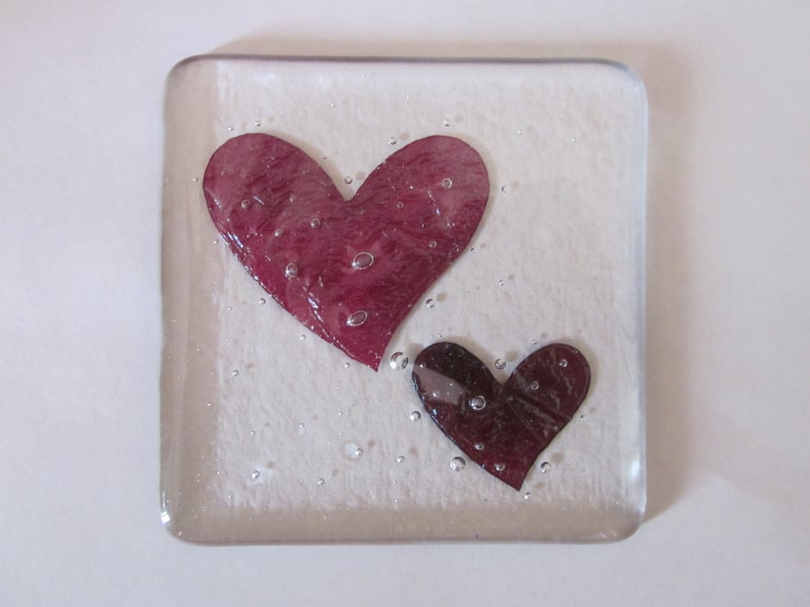 Handmade fused glass coaster - copper swirly hearts in clear glass
