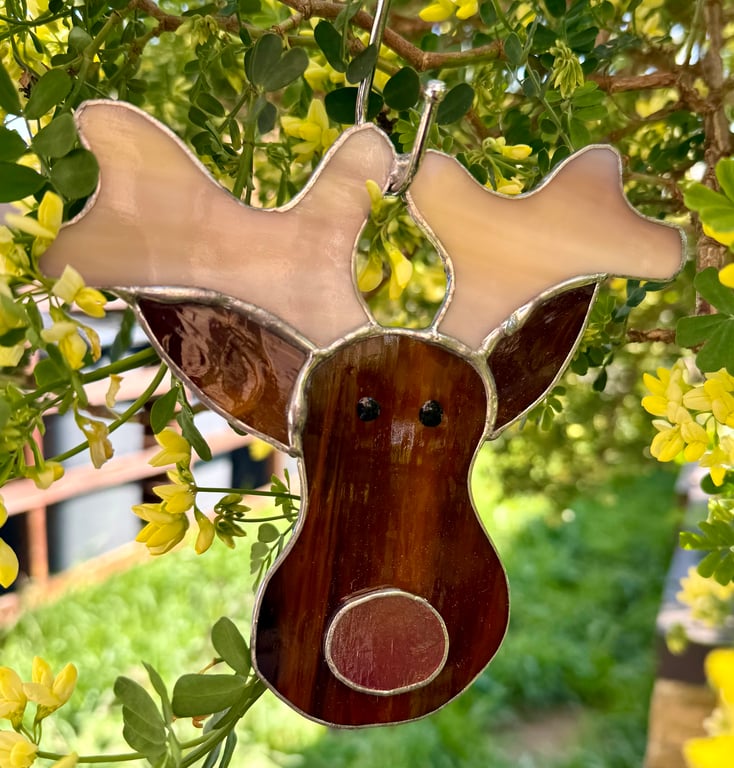 Stained glass reindeer suncatcher decoration in dark brown with red nose