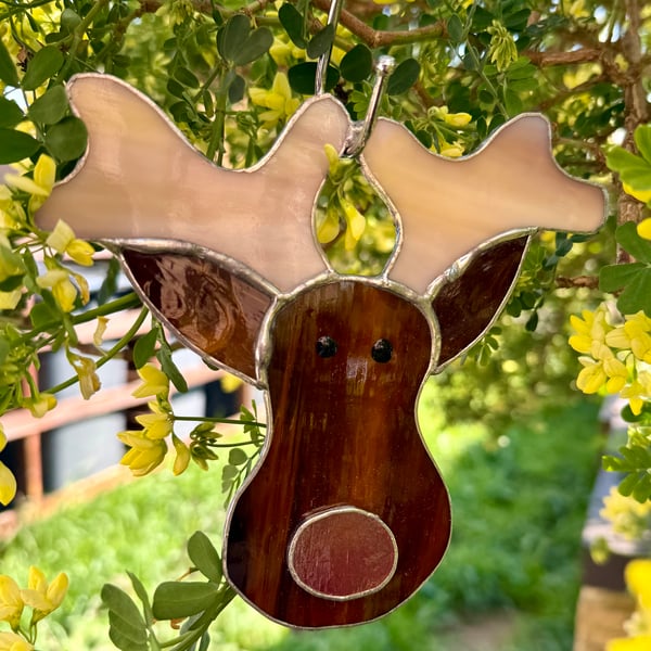 Stained glass reindeer suncatcher decoration in dark brown with red nose