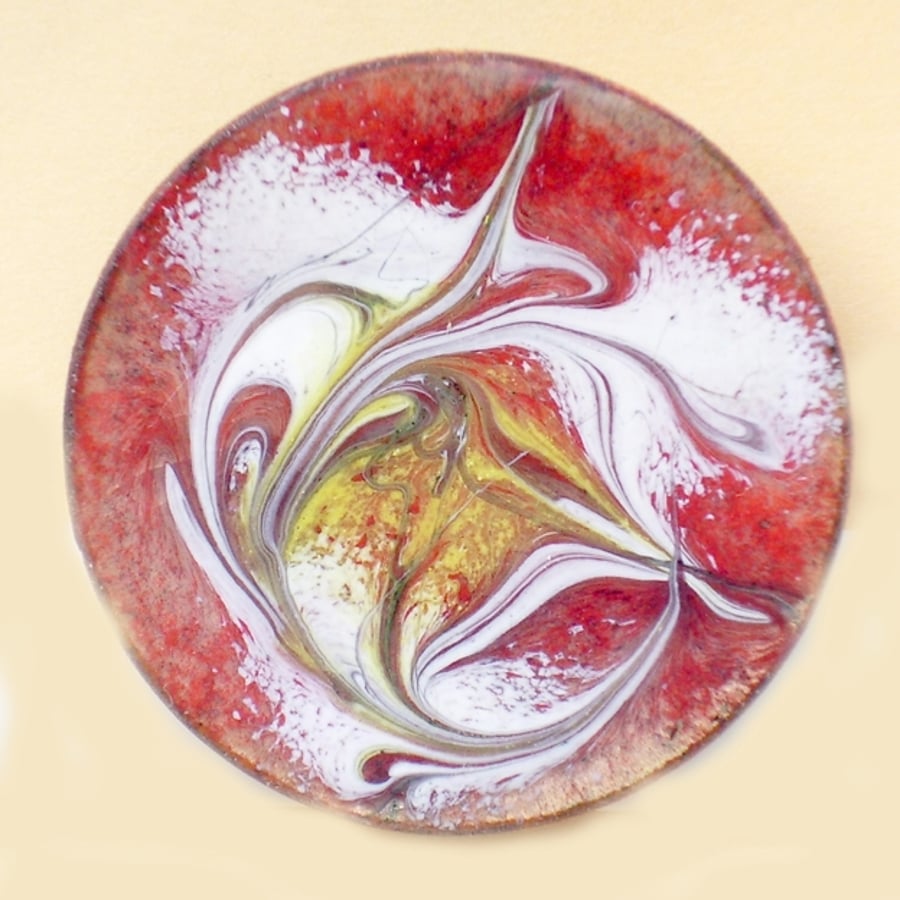 round enamel brooch - scrolled white and gold on red