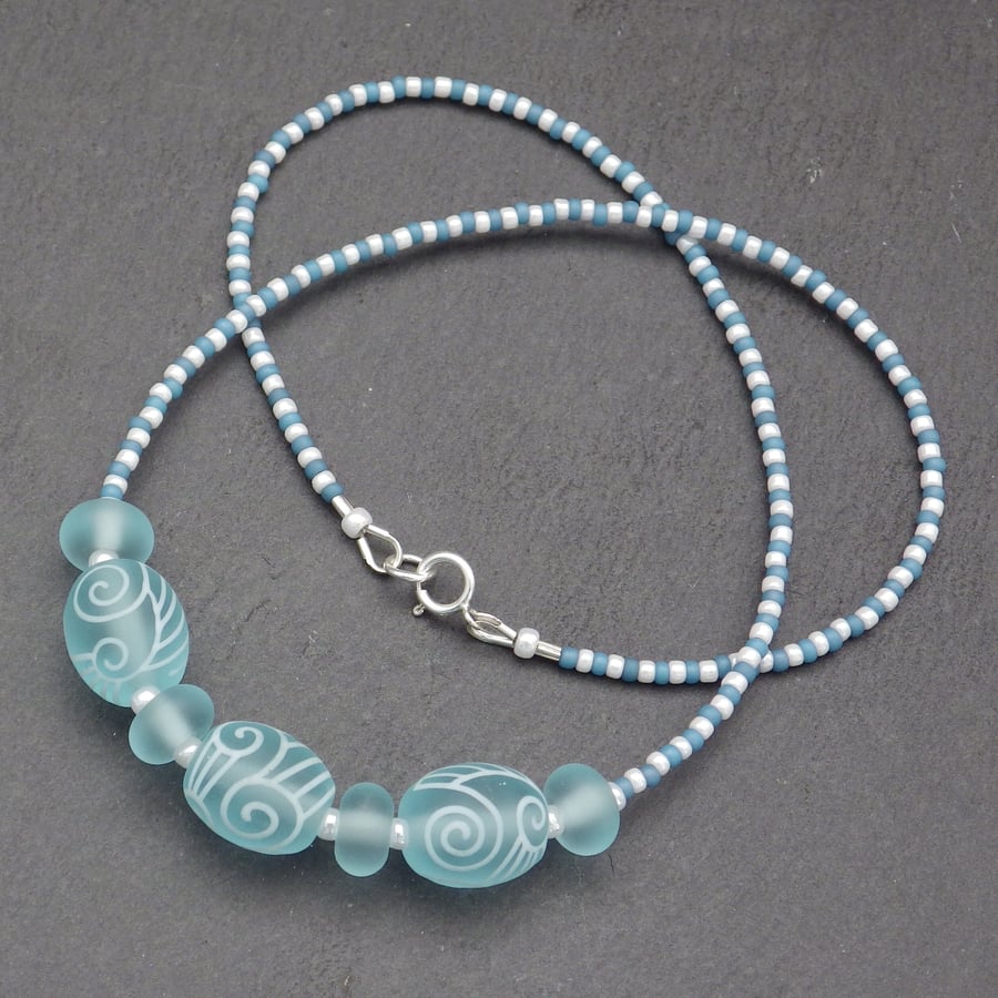 Aquamarine blue and white swirl lampwork glass bead necklace