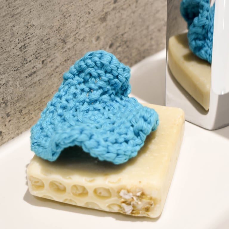 Hand knitted cotton facial scrubbie - turquoise blue