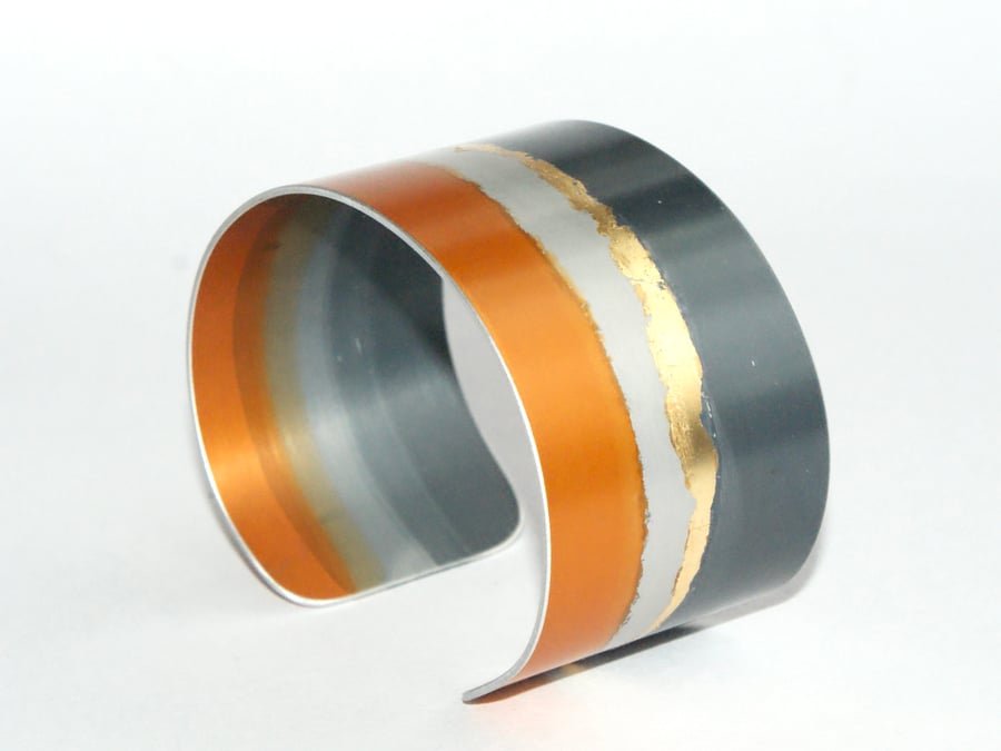 Grey and orange landscape cuff