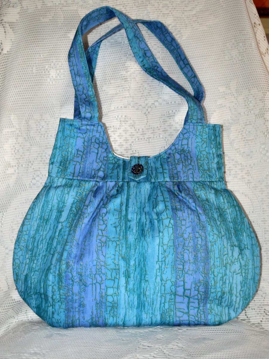 A pretty blue variegated handbag