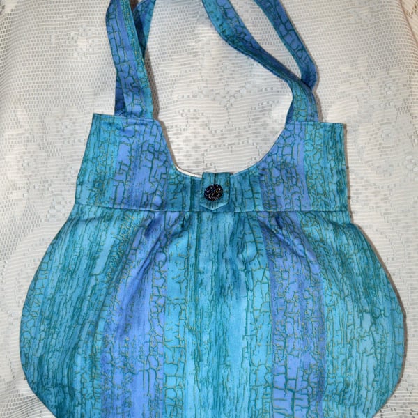 A pretty blue variegated handbag