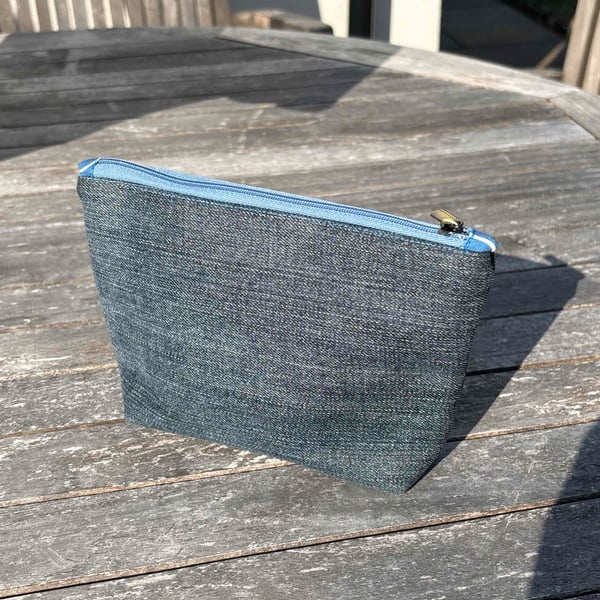 Denim zip top purse with blue squiggle lining