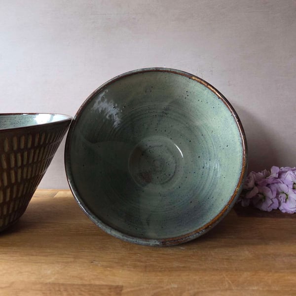 Textured conical stoneware pottery bowl in blue with incised pattern 