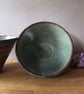 Textured conical stoneware pottery bowl in blue with incised pattern 