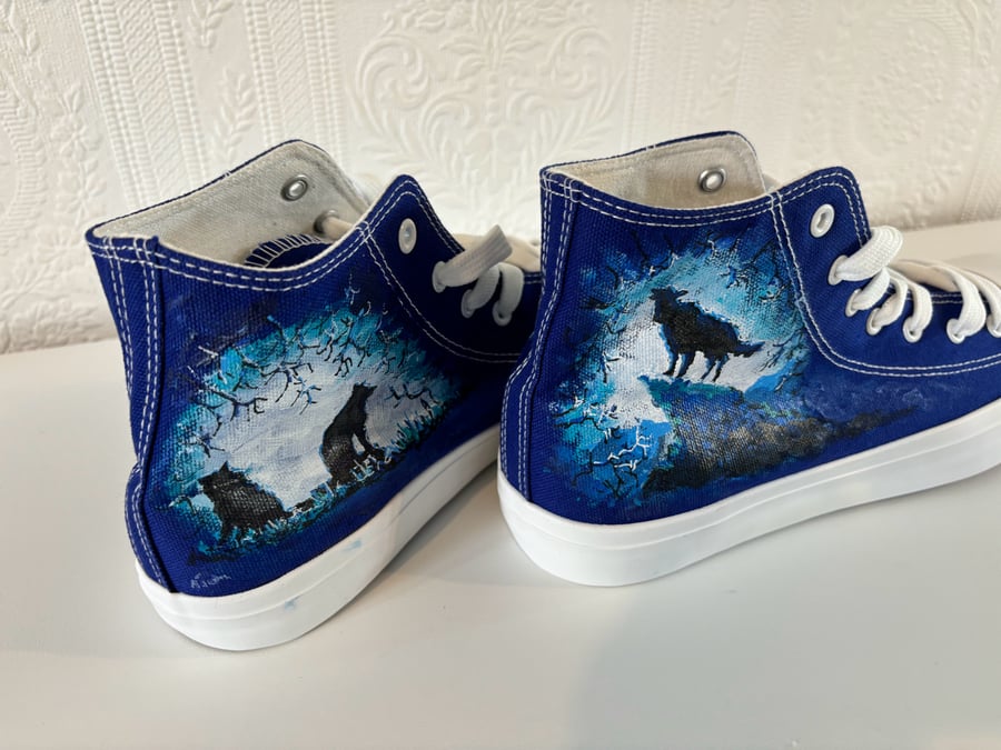 A pair of hand painted and sealed high tops by Andrew Jenkins 