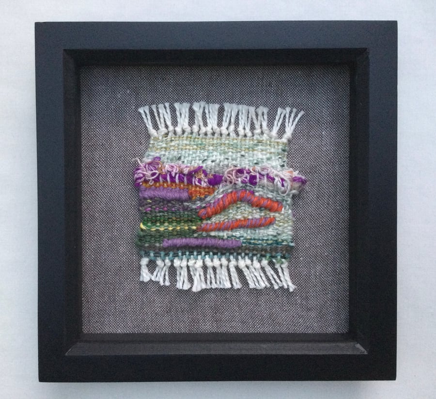 Framed handwoven tapestry weaving, textile wall art in purple, green and orange