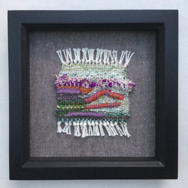 Framed handwoven tapestry weaving, textile wall art in purple, green and orange