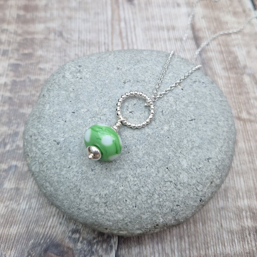 Sterling Silver Circle Necklace with Green Spotty Lampwork Glass Bead