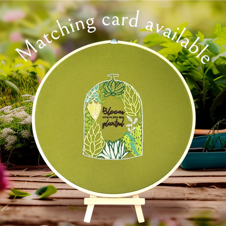 Unique hand embroidered wall hanging. Terrarium filled with gorgeous plants. 