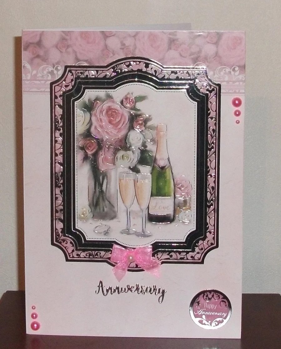 Wedding Anniversary Celebration A5 card with Champagne and roses.
