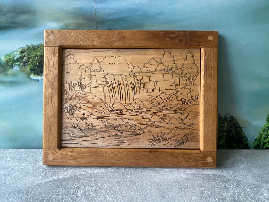 Solid hardwood framed waterfall scene engraving