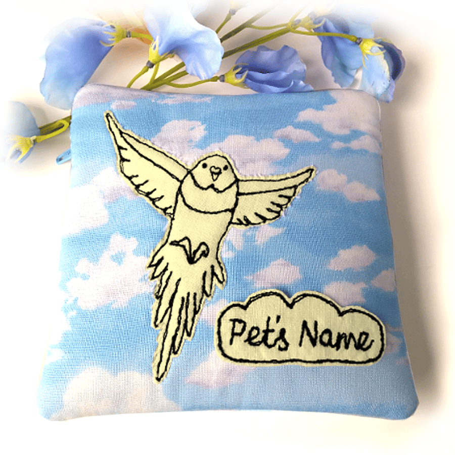 Small pet memorial pouch – Flying bird image in yellow against blue sky