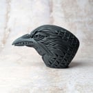 'Ignis', a black porcelain crow idol.