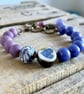 Bohemian Style Bracelet with Artisan Ceramic Heart Charm & Purple Glass Beads - Image 1