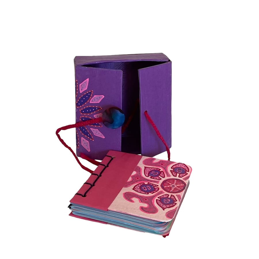 Small hand made note book in a box