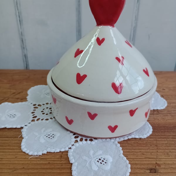 White lidded pot with red heart design