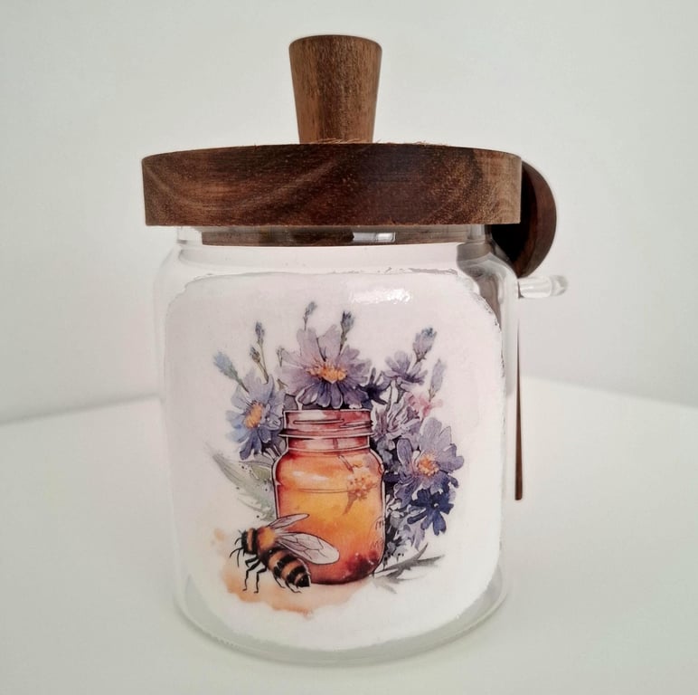 Glass honey jar with wooden lid and spoon