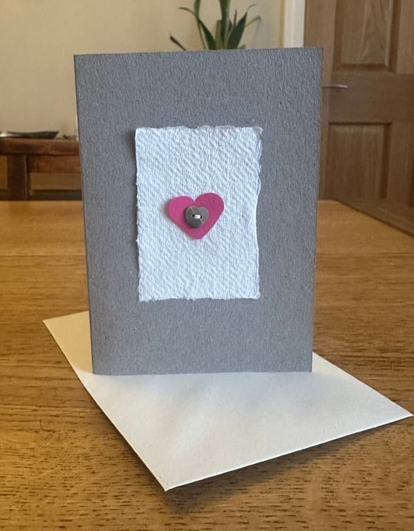 Greetings card with pink heart & heart shaped mother of pearl button 