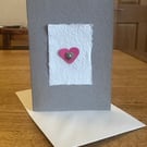 Greetings card with pink heart & heart shaped mother of pearl button 