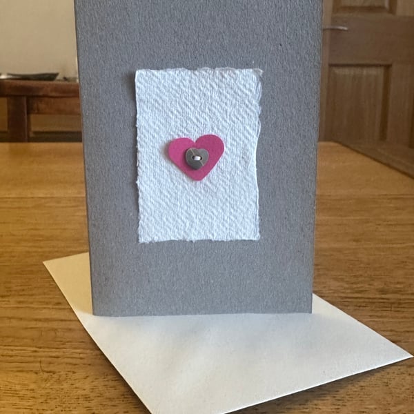 Greetings card with pink heart & heart shaped mother of pearl button 