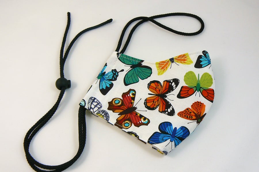 Face mask with removable nose wire , filter pocket  and drawstring toggle