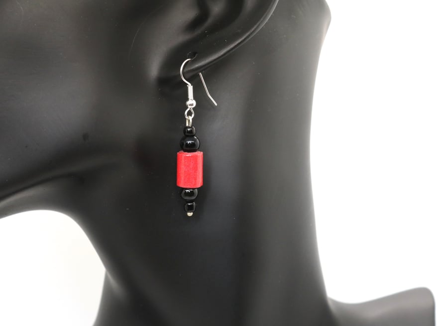 Small red and black earrings made of red paper beads and recycled black beads