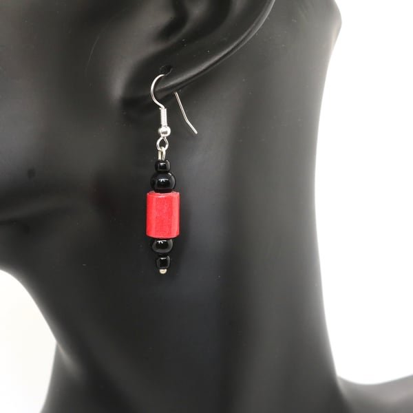 Small red and black earrings made of red paper beads and recycled black beads