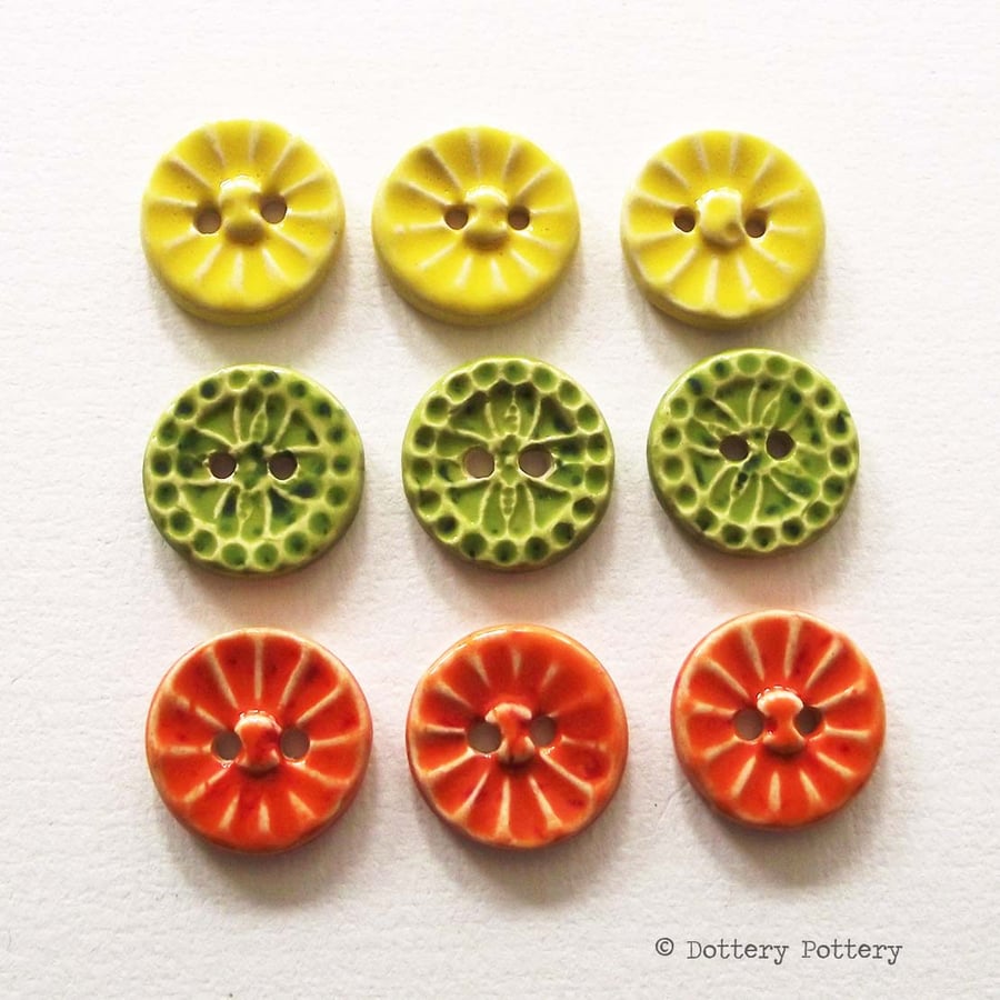 Set of nine little handmade ceramic buttons citrus colours