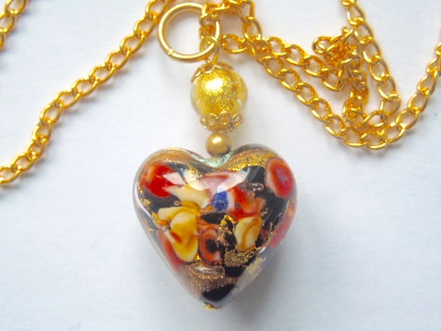 Murano glass gold and black decorated heart pendant.