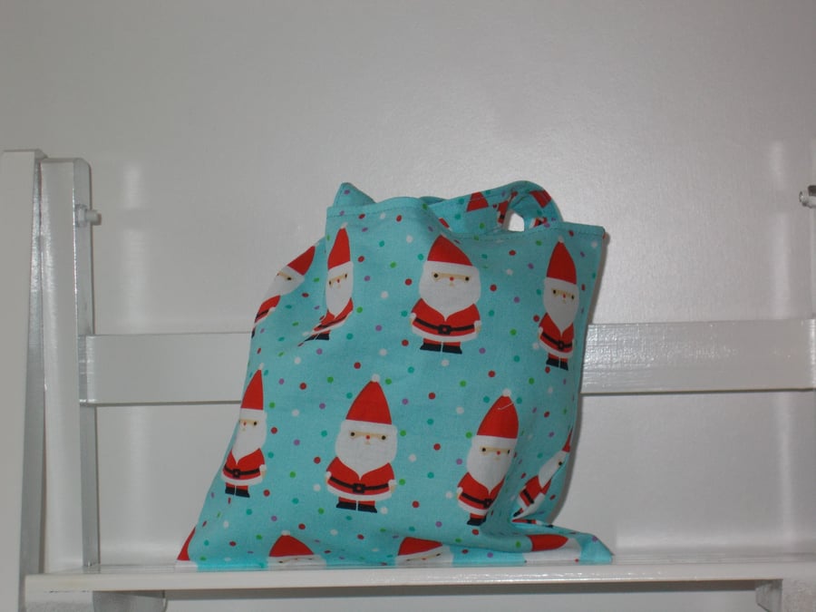 Mini Christmas present bag printed with Father Christmas