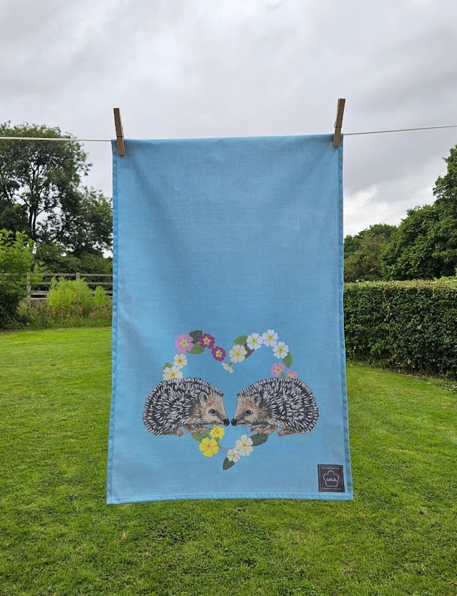 Hedgehogs in primroses heart tea towel design, organic cotton, hanging loop