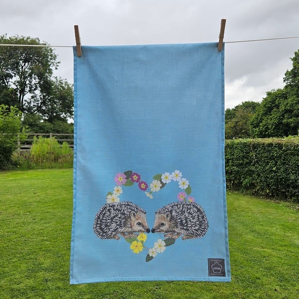 Hedgehogs in primroses heart tea towel design, organic cotton, hanging loop