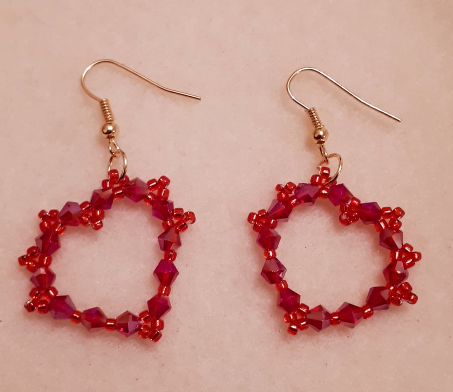 Cute large red crystal heart shaped earrings.