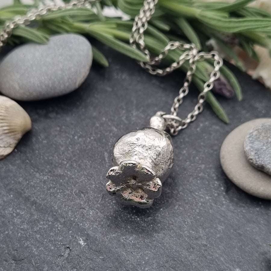 Real poppy seed preserved in silver pendant necklace 