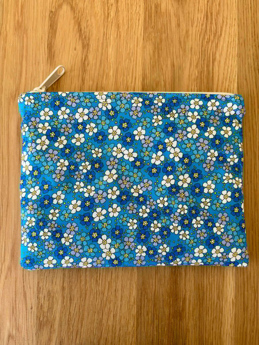 Zipped fabric pouch, purse, make up bag, in a blue daisy floral print