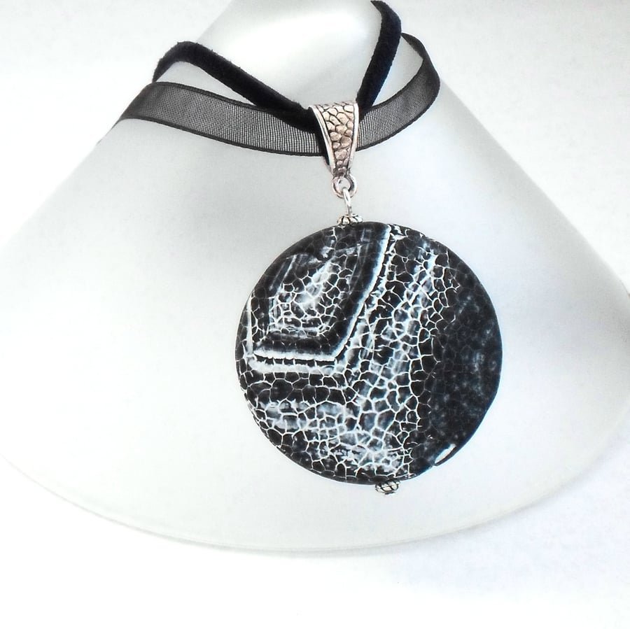 Black & white monochrome fossil agate coin pendant, on ribbon and suede hanging