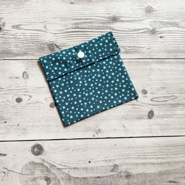 Discreet sanitary pouch. Feminine products holder. Spotty theme.
