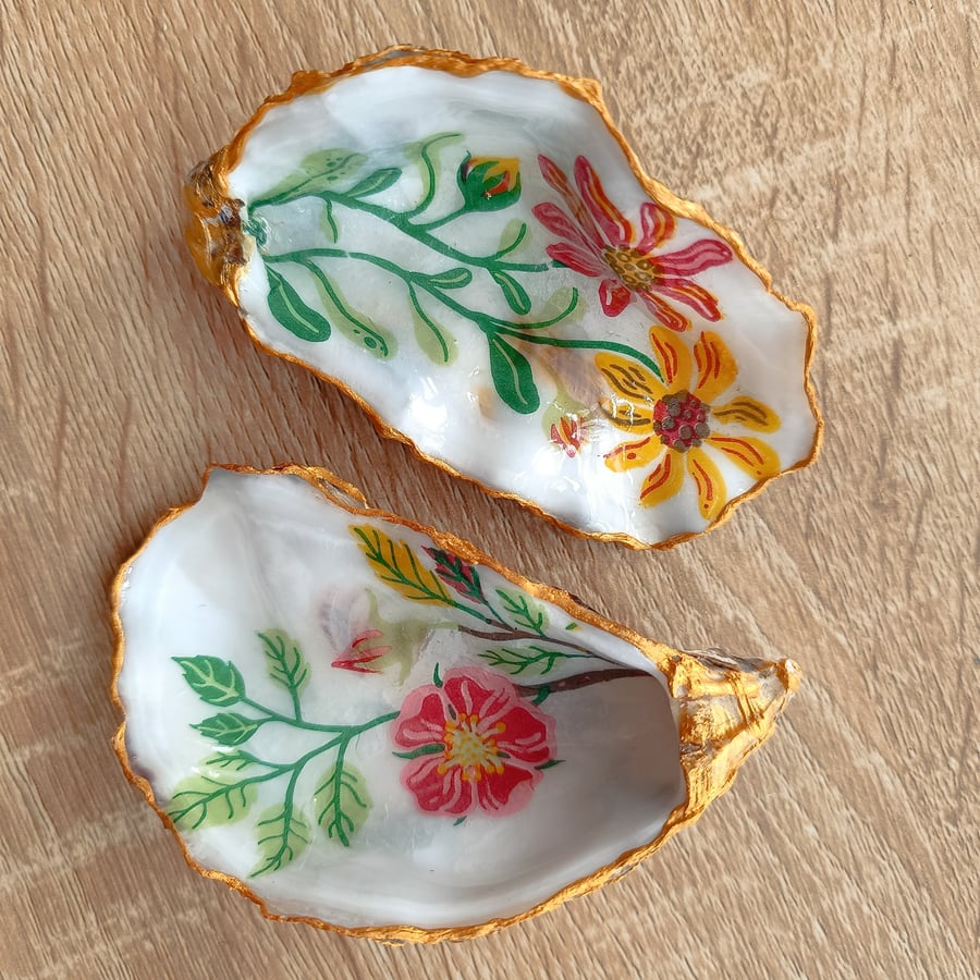 Two floral hand-finished oyster shells